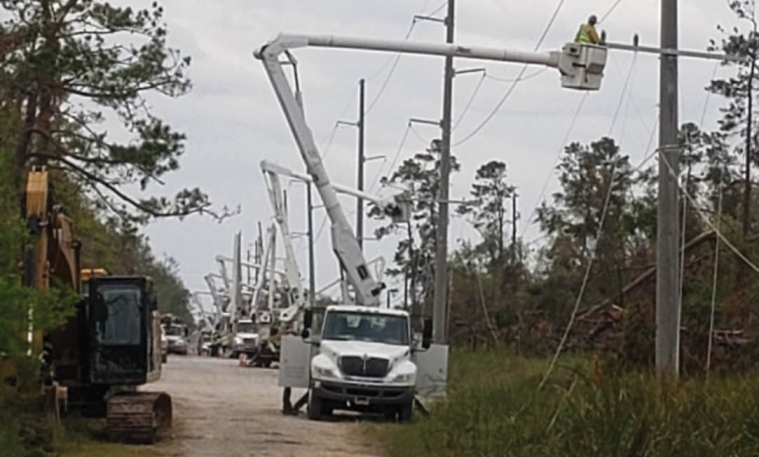 valiant bucket truck repairing damaged powerlines