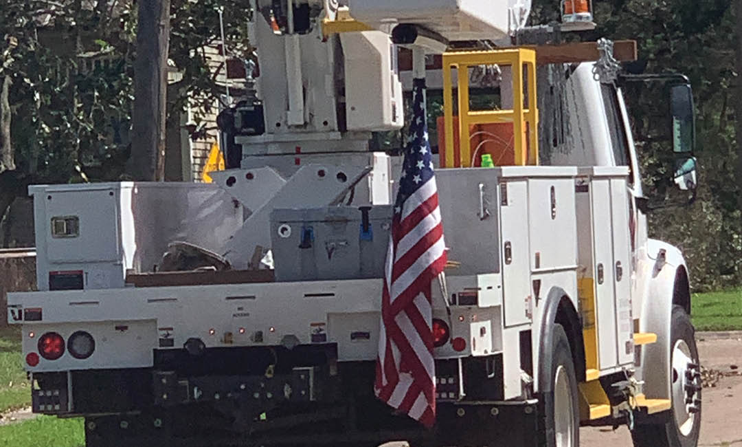 valiant bucket truck with american flag