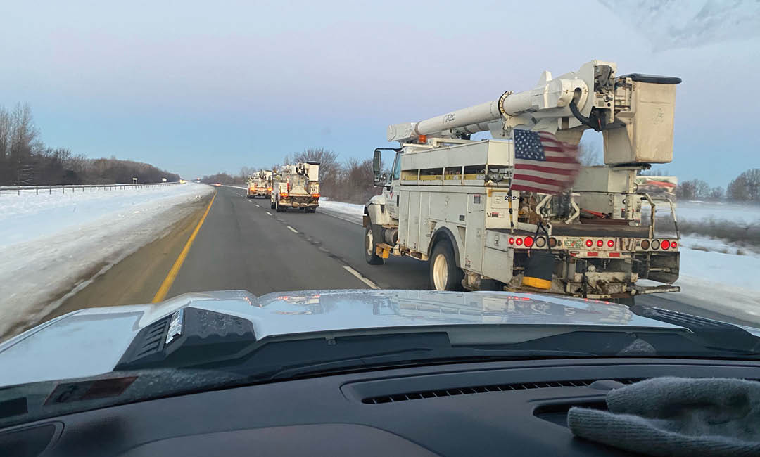 valiant storm bucket trucks driving south on highway