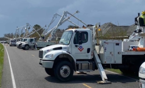 valiant-trucks-lined-up-in-front-of-storm-min
